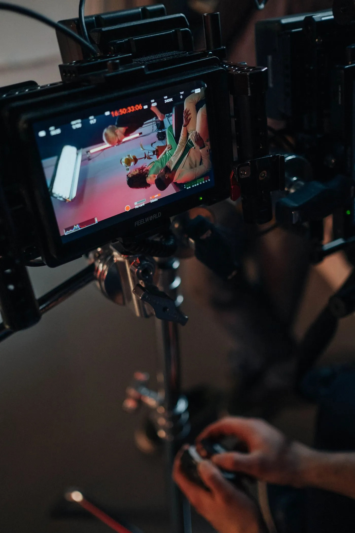 A camera operator checking the monitor on a camera rig