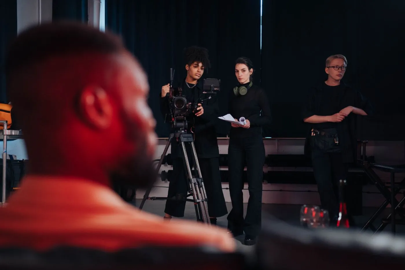 A camera crew working in a studio